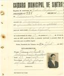 Registo de matricula de cocheiro profissional em nome de Firmino dos Santos, morador em Massamá, com o nº de inscrição 975.