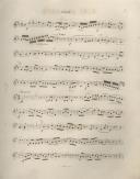 Livro com diversas partituras de música para piano e flauta.
